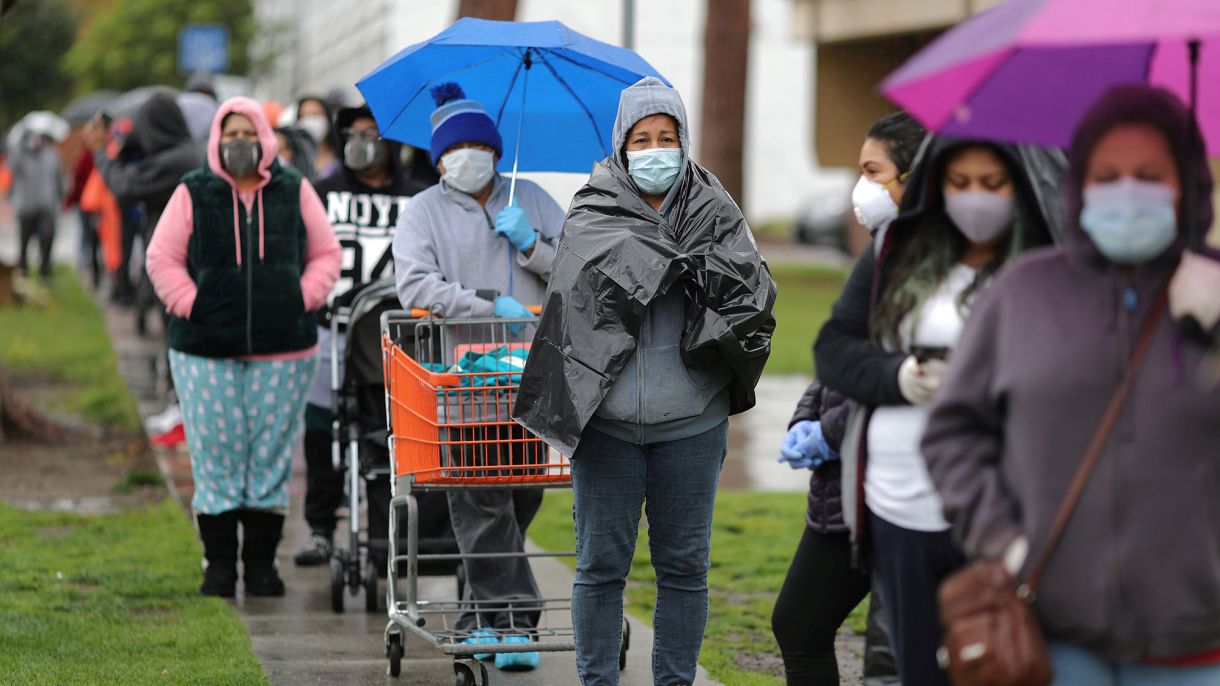 People queue to pick up fresh food at a Los Angeles Regional Food Bank, as the spread of the coronavirus disease (COVID-19) continues