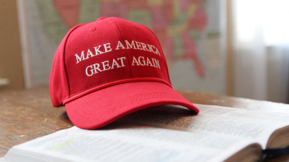 A red hat with the text "make America great again" on it