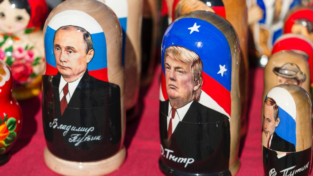 Russian nesting dolls side by side. One has Donald Trump painted on it and the other has Vladimir Putin painted on.