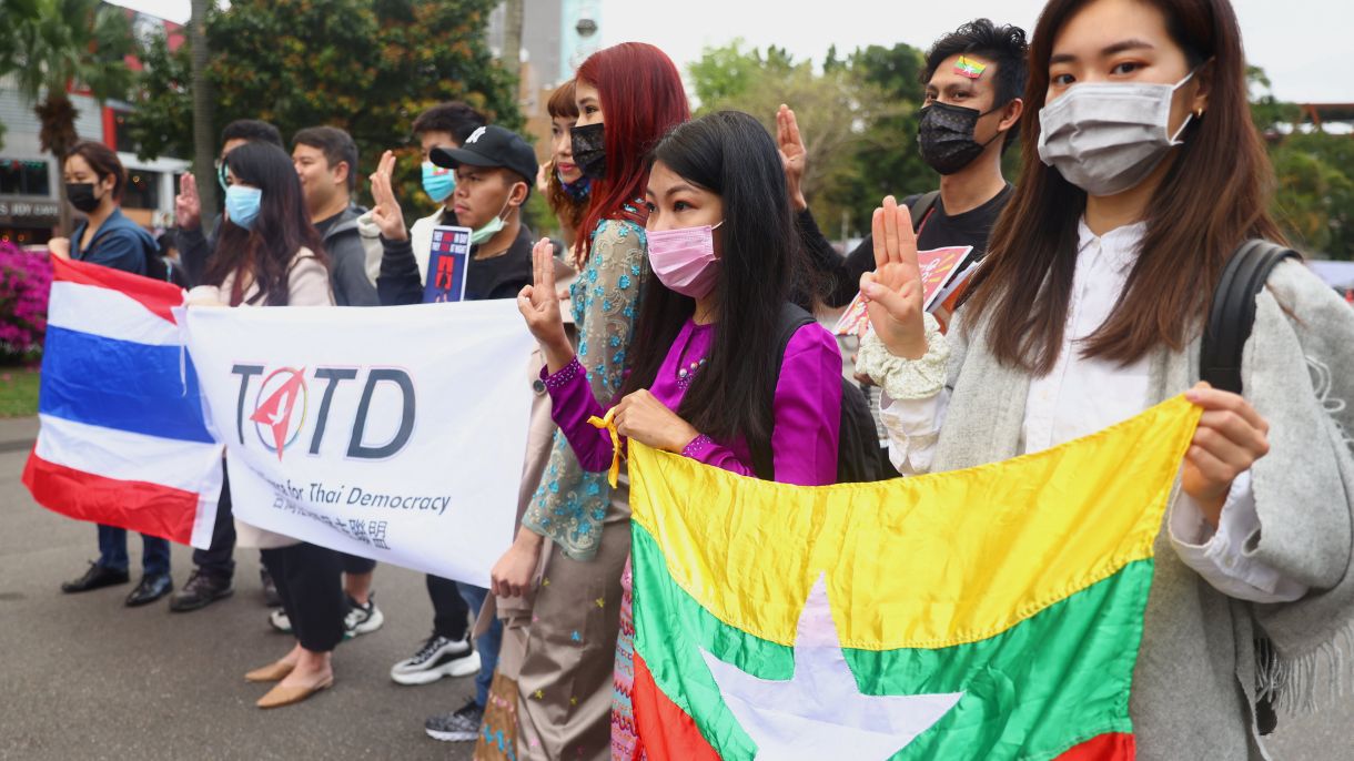 People show the three-finger salute against the Myanmar military coup as part of the Milk Tea Alliance united rally in Taipei, Taiwan