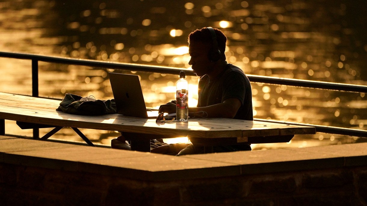 A remote worker at Lake Roland in Maryland.