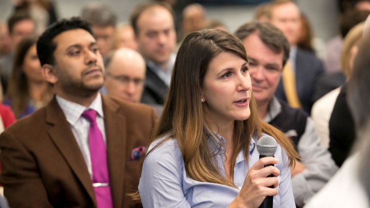 A member asks a question at an event. 