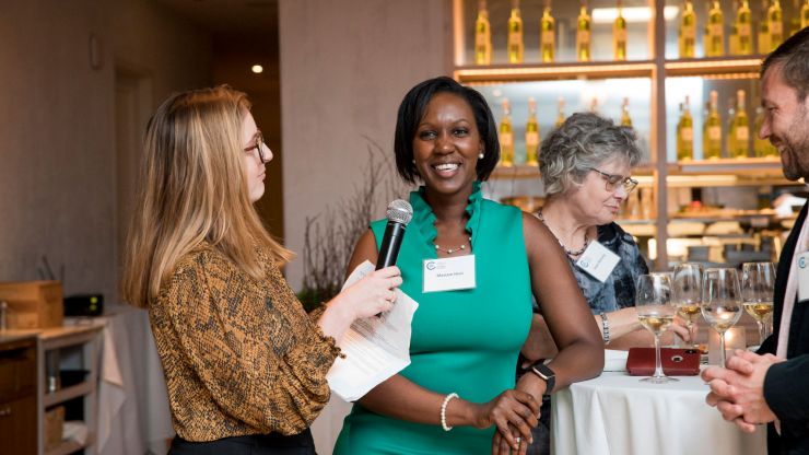 Two Emerging Leaders sharing the mic at an event.