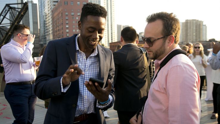 Members of the YP Network talking at the annual summer party