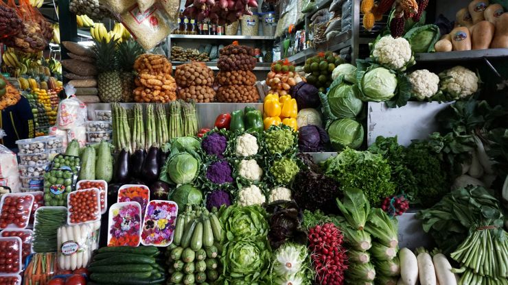 Vegetables are displayed for sale at a stand at Surquillo market in Lima, Peru.