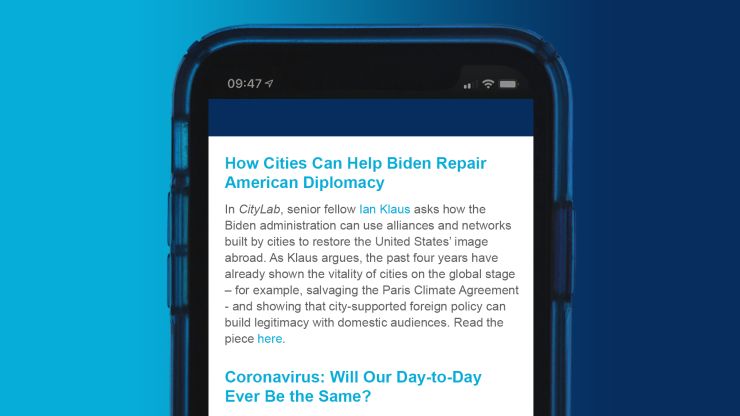 A smartphone with the Global Cities Insights newsletter on the screen.