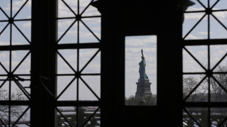 the Statue of Liberty seen through a window
