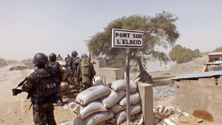 Cameroon soldiers stand guard at a lookout post as they take part in operations against the Islamic extremists group Boko Haram