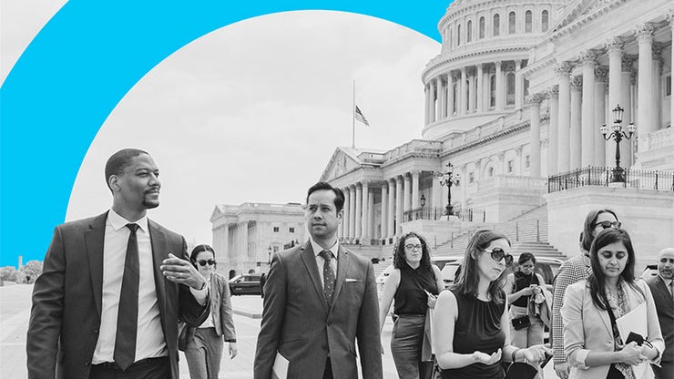 Black and white picture of people in front of the US Capitol