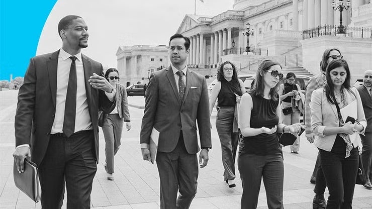 Black and white picture of people in front of the US Capitol