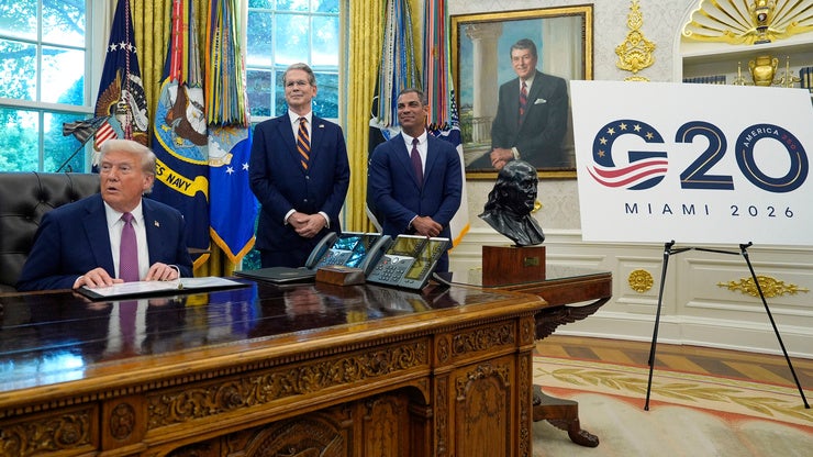 President Donald Trump speaks in the Oval Office of the White House as Treasury Secretary Scott Bessent and Miami Mayor Francis Suarez listen