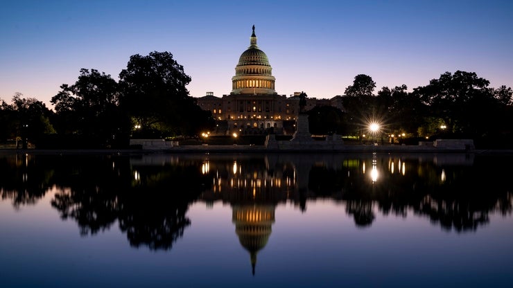 The US Capitol with its reflection in water
