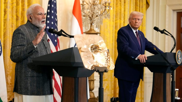 India's Prime Minister Narendra Modi speaks as President Donald Trump listens during a news conference in the East Room of the White House