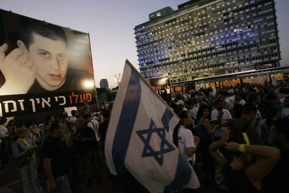 protesters holding signs 