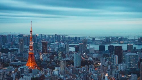 The Tokyo skyline at dusk with a view of the Tokyo Tower.