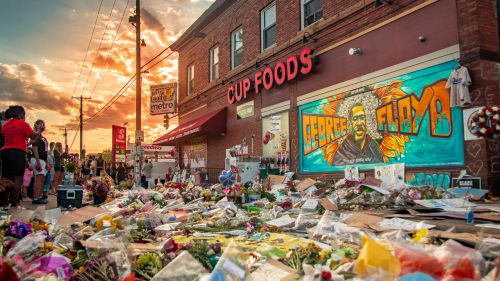 Flowers and tributes placed in front of the Cup Foods in Minneapolis near where George Floyd was killed.