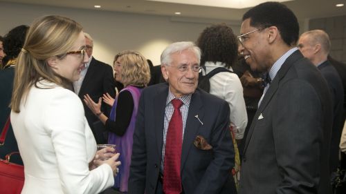 Three Council members talking before a public program