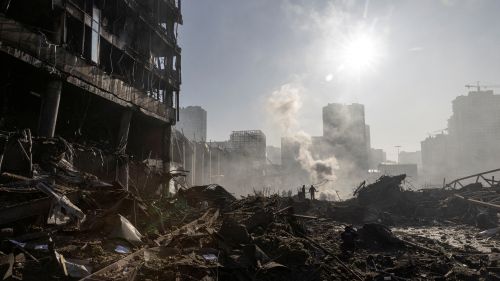 Destruction shown before a city skyline in Kyiv. 