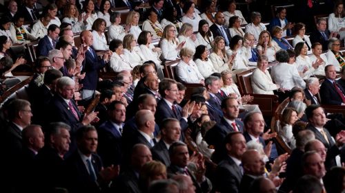 Crowd of legislators separated by gender. 