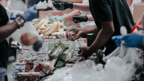 A group of people prepares food for a food assistance program.