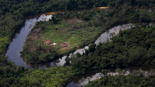A village of Indigenous Yanomami is seen during Brazil’s environmental agency operation against illegal gold mining on Indigenous land, in the heart of the Amazon rainforest, in Roraima state, Brazil. The Yanomami people are living in dire conditions as a result of illegal gold miners blocking the delivery of food and medicine.