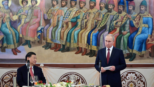 Putin and Xi in Moscow in front of a mural.