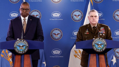 Secretary Austin and General Milley stand at lecturns