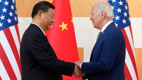 President Joe Biden and Chinese President Xi Jinping shake hands 