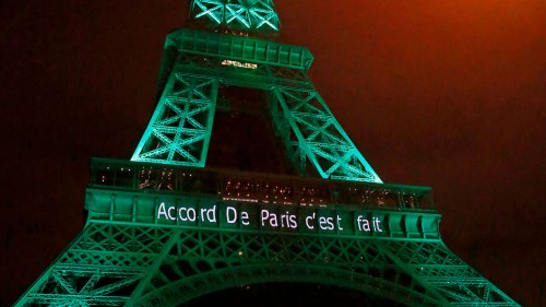 the Eiffel Tower lit up in green to mark the success of the Paris Agreement to slash man-made emissions of carbon dioxide and other global warming gases to counter climate change