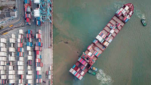 a cargo ship leaves a port