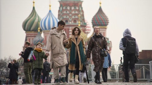 People in the Red Square, with the St. Basils Cathedral in the background, in Moscow
