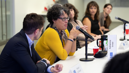 A woman asks a question during an Emerging Leaders roundtable.