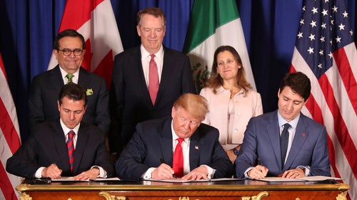 In this Nov. 30, 2018 file photo, President Donald Trump, center, sits between Canada's Prime Minister Justin Trudeau, right, and Mexico's President Enrique Pena Nieto as they sign a new United States-Mexico-Canada Agreement
