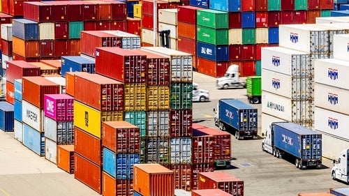 Cargo containers line a shipping terminal at the Port of Oakland on July 31, 2025.