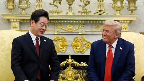 US President Donald Trump and South Korean President Lee Jae Myung sitting in a meeting.