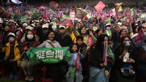Supporters cheer for the Democratic Progressive Party during an elections rally