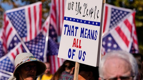Protesters gather outside the U.S. Immigration and Customs Enforcement regional field office in Burlington, Mass