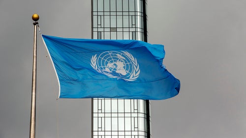 The UN flag flies on a stormy day at the United Nations during the United Nations General Assembly