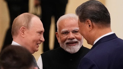 Vladimir Putin, Narendra Modi, and Xi Jinping speak at the Shanghai Cooperation Organization summit on September 1, 2025.