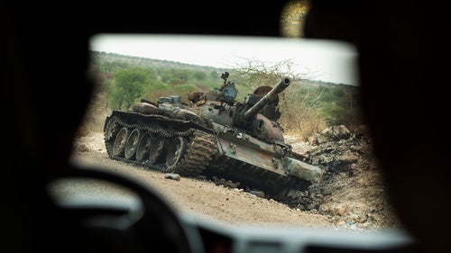 A destroyed tank is seen by the side of the road south of Humera, in an area of western Tigray