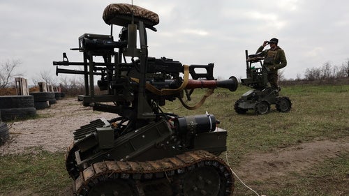 In this photo provided by Ukraine's 65th Mechanized Brigade press service, a soldier tests land drones in Zaporizhzhia region, Ukraine