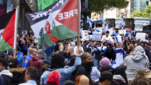 Supporters of Israel and Palestinian supporters gather at the Israeli Consulate in New York