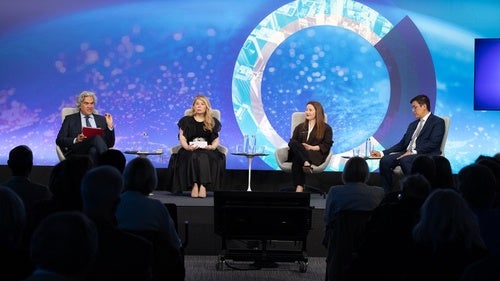 Speakers on a stage