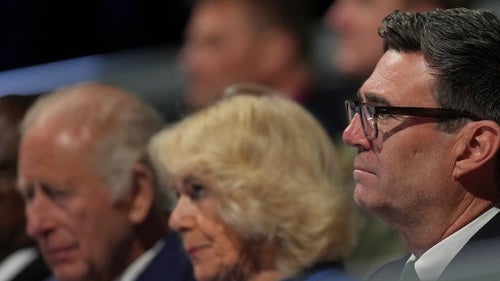 British Prime Minister Andy Burnham sits next to Queen Camilla and King Charles III at the Commonwealth Games opening ceremony in Glasgow, Scotland on July 27, 2026.