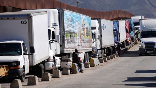 Trucks line up to cross the border into the United States
