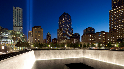 The Tribute in Light shines above a reflecting pool at the National September 11 Memorial in New York City on September 11, 2012.