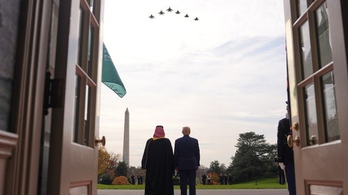President Donald Trump and Saudi Arabia's Crown Prince Mohammed bin Salman watch a flight of F-35's and F-15's fly over during a welcome ceremony on the South Lawn of the White House, Tuesday, Nov. 18, 2025, in Washington.
