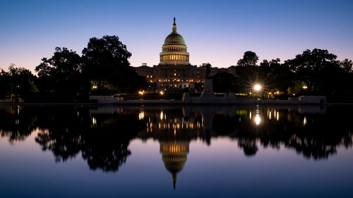 The US Capitol with its reflection in water