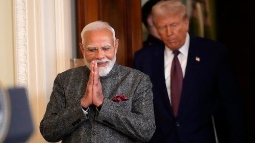 India's Prime Minister Narendra Modi and President Donald Trump arrive for a news conference in the East Room of the White House.