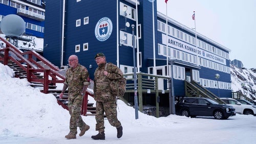 Danish servicemen walk in front of Joint Arctic Command center in Nuuk, Greenland, on Friday, Jan. 16, 2026. 